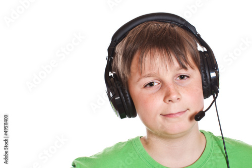 Photo: Boy listening to music with headphones Boy listening to music with headphones