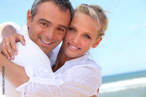 Photo: Embracing on the beach Embracing on the beach