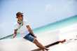 Portrait of an attractive young man on a tropical beach