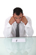 Bored businessman sat at desk