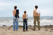 Photo: Men looking at the ocean. Men looking at the ocean.