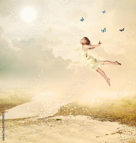 Photo: Little Girl Flying at Twilight Little Girl Flying at Twilight