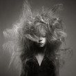 Young girl with a volume fashionable hairstyle