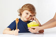 Little cute boy is going to have breakfast a cereal