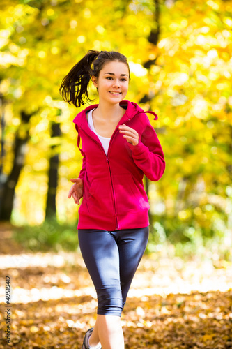 Photo: Girl running in park Girl running in park