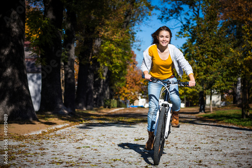 Photo: Girl biking Girl biking