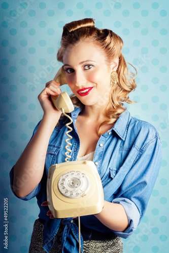 Photo: Sixties Woman Holding Vintage Telephone Handset Sixties Woman Holding Vintage Telephone Handset