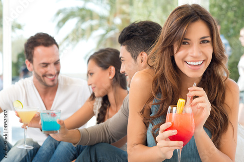 Photo: Happy Woman Drinking Cocktail Happy Woman Drinking Cocktail