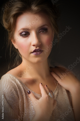 Photo: Portrait of young girl on grey Portrait of young girl on grey