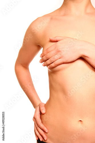 Photo: Female body with a breast covered isolated on white background Female body with a breast covered isolated on white background