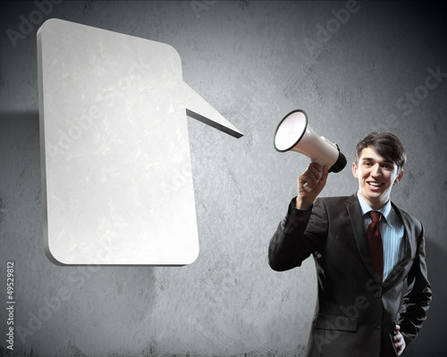 Photo: businessman with megaphone businessman with megaphone
