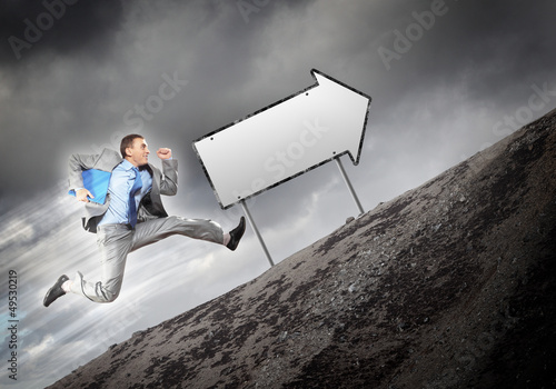 Photo: Businessman running on the road Businessman running on the road