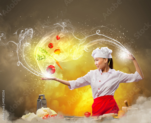 Photo: Asian female cooking with magic Asian female cooking with magic