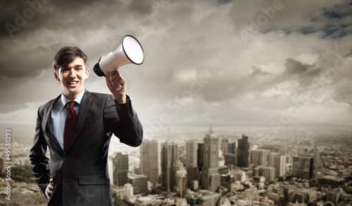 Photo: businessman with megaphone businessman with megaphone