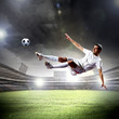 football player striking the ball