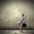 Business woman marionette