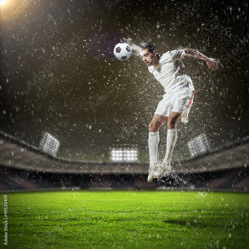Photo: football player striking the ball football player striking the ball