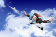 Young businessman flying with parachute on back