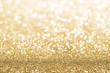 Gold defocused glitter background with copy space