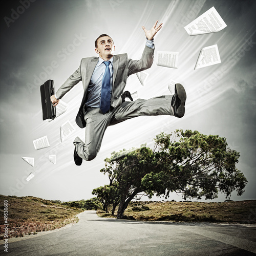 Photo: Businessman running on the road Businessman running on the road