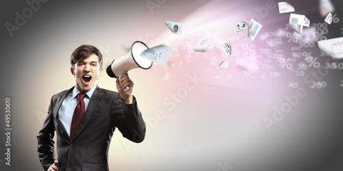 Photo: businessman with megaphone businessman with megaphone