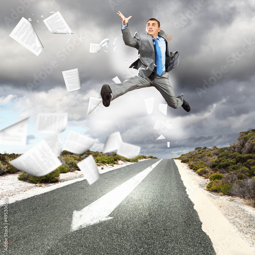 Photo: Businessman running on the road Businessman running on the road