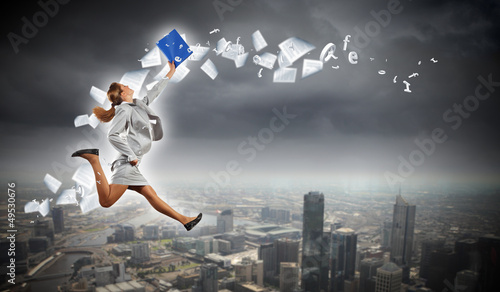 Photo: Image of running businesswoman Image of running businesswoman