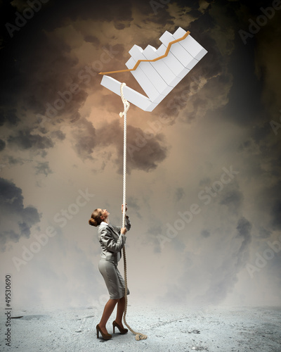 Photo: Image of businesswoman climbing the rope Image of businesswoman climbing the rope