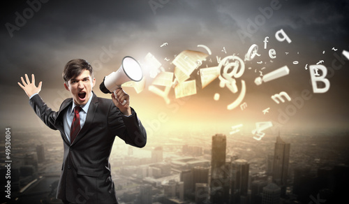 Photo: businessman with megaphone businessman with megaphone