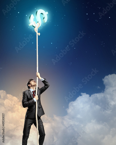 Photo: Image of businessman climbing rope Image of businessman climbing rope