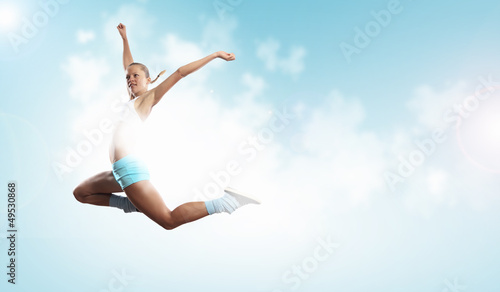 Photo: Image of sport woman jumping Image of sport woman jumping
