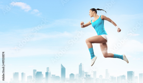 Photo: Image of sport woman jumping Image of sport woman jumping