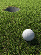 3d Golf ball rolls towards the hole