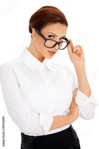 Photo: Woman peering over her glasses Woman peering over her glasses
