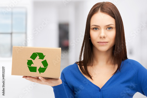 Photo: attractive businesswoman with recyclable box attractive businesswoman with recyclable box