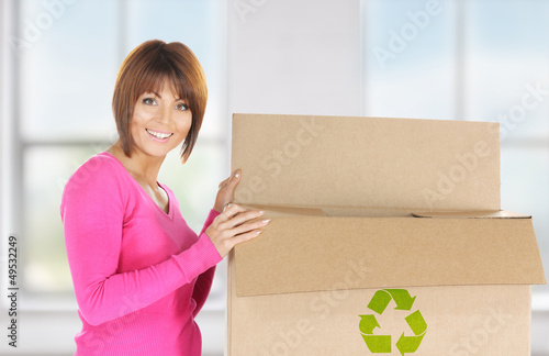 Photo: attractive businesswoman with recyclable box attractive businesswoman with recyclable box