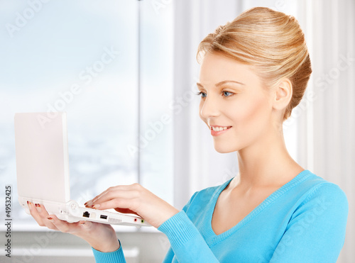 Photo: woman with laptop computer woman with laptop computer