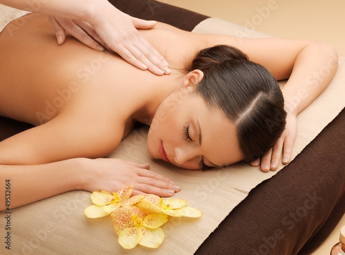 Photo: beautiful woman in massage salon beautiful woman in massage salon