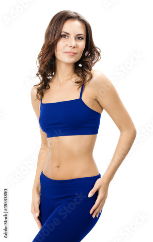 Photo: Full body of smiling woman in sports wear, isolated Full body of smiling woman in sports wear, isolated