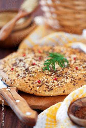 Photo: Oat bran and flax seed flatbread, selective focus Oat bran and flax seed flatbread, selective focus