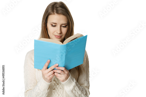 Photo: Concentrated woman reading the book Concentrated woman reading the book