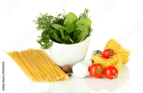 Photo: Composition of mortar, pasta and green herbals, isolated Composition of mortar, pasta and green herbals, isolated