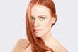 Young woman touches her hair