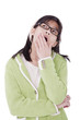 Girl in green sweater and glasses looking up, yawning
