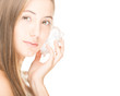 Photo: Pretty woman with seashell isolated on white. Pretty woman with seashell isolated on white.