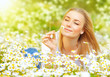 Photo: Woman in chamomile field Woman in chamomile field