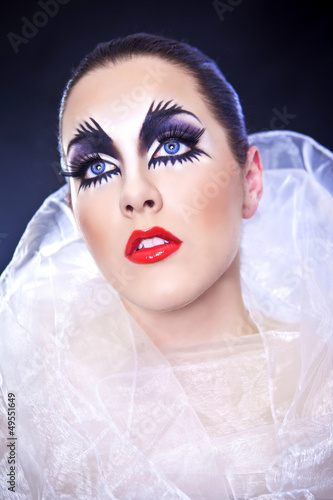 Photo: Artistic, theatrical makeup woman. Artistic, theatrical makeup woman.