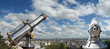 A telescope viewer overlooks view Paris skyline