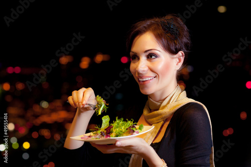 Photo: Woman eating salad Woman eating salad