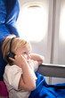 Foto: child with headphones in the plane child with headphones in the plane